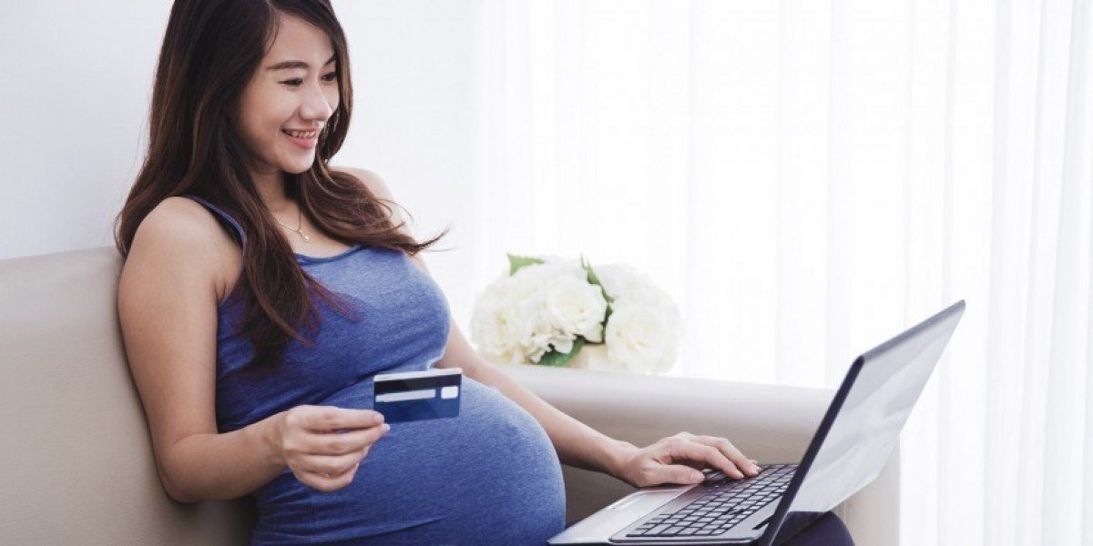 Happy mummy making an online payment worry-free. 
